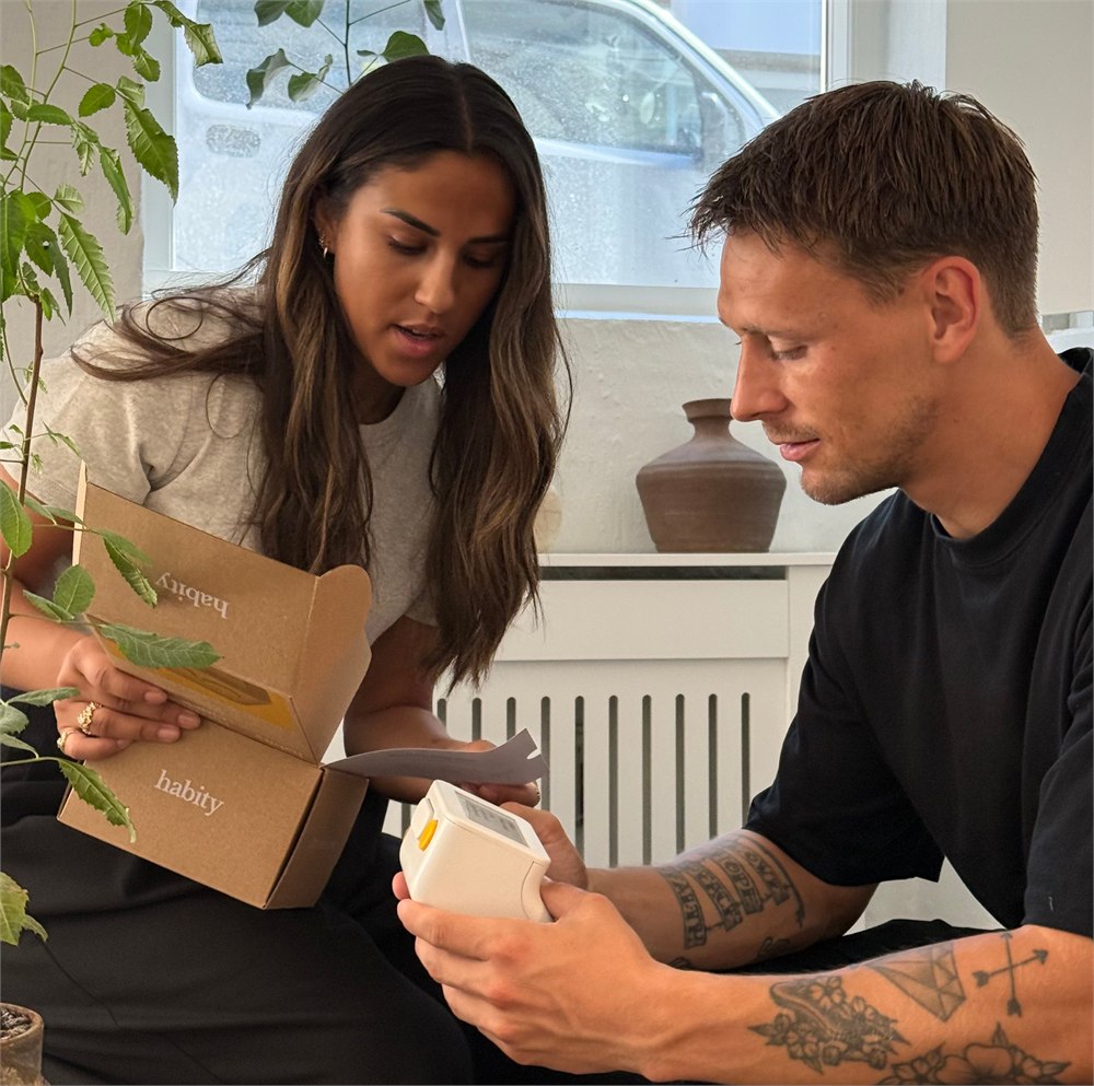 Habity bedside clock being unboxed with its packaging
