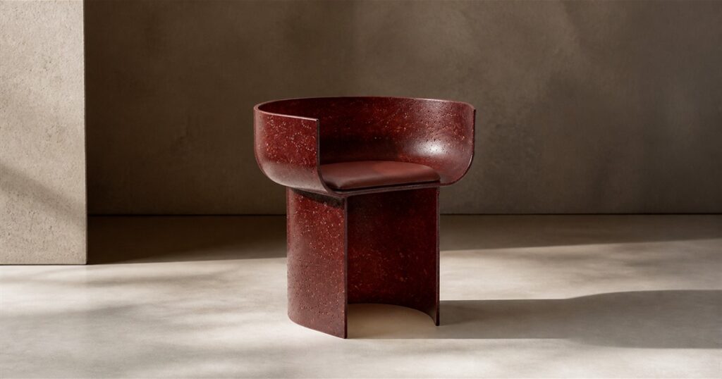 No-text editorial image of the Gallotti and Radice Half-Pipe recycled glass armchair