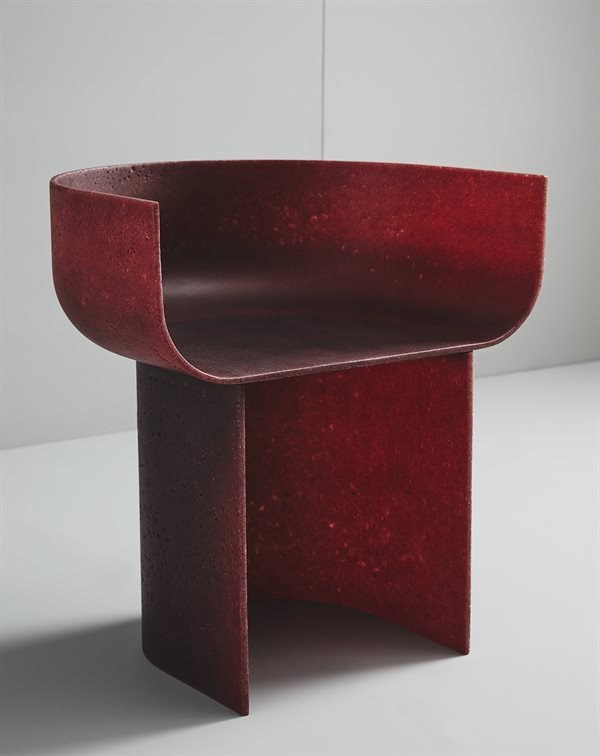 Gallotti and Radice Half-Pipe armchair three-quarter view showing curved body