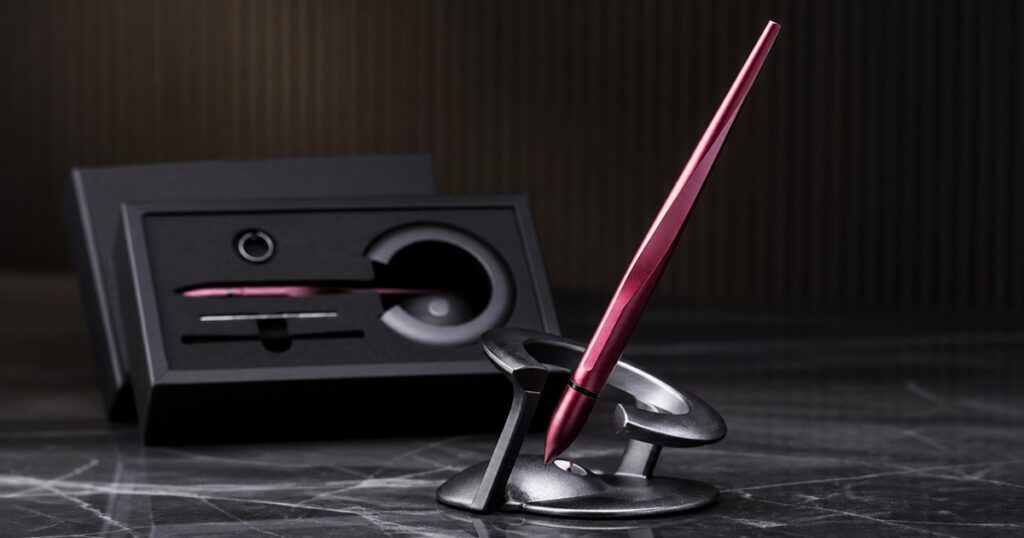 Levitating burgundy Hoverpen Interstellar on its magnetic base