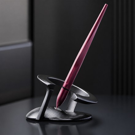 This Levitating 23-Degree Ballpoint Pen Spins On a Magnetic Desk Stand