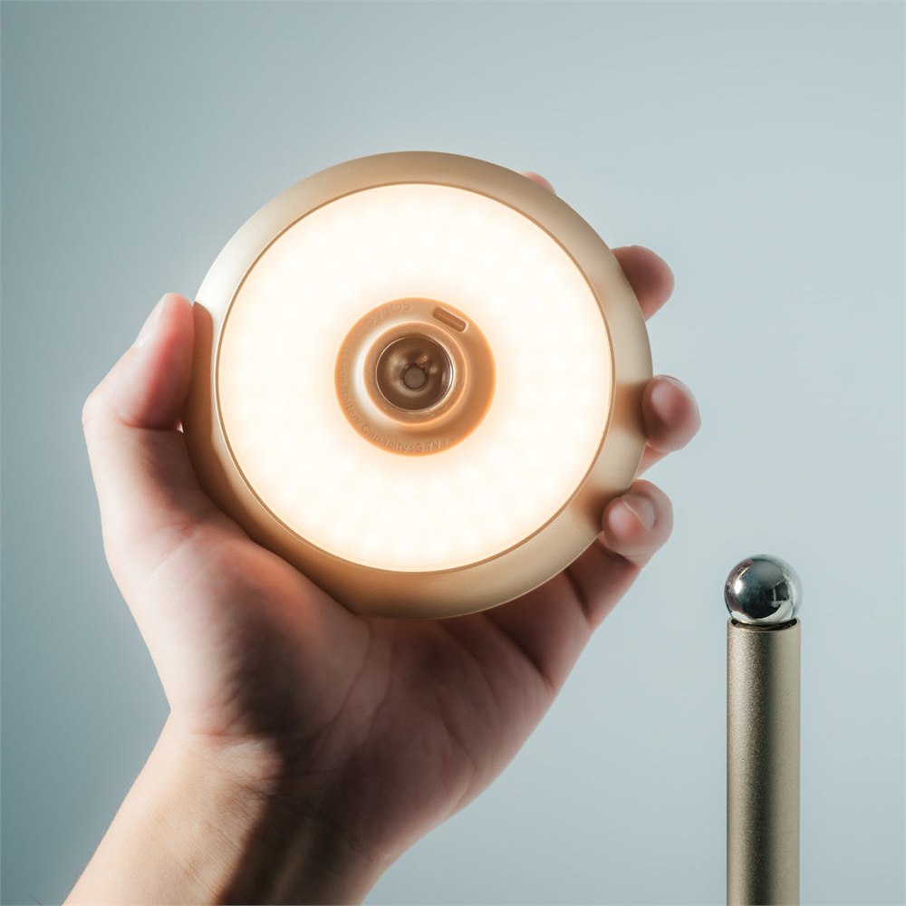 Infinite Solas detachable glowing magnetic lamp head held near its stand