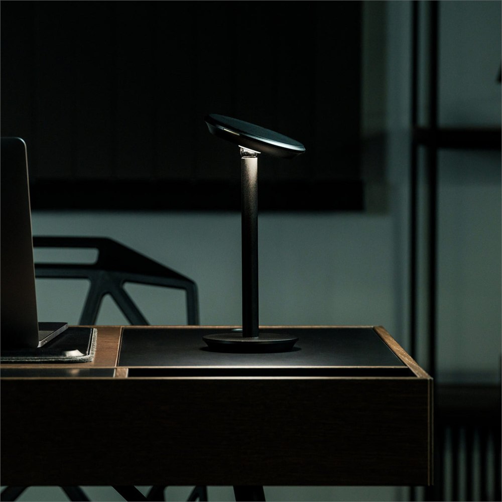 Infinite Solas cordless desk lamp glowing on a tabletop