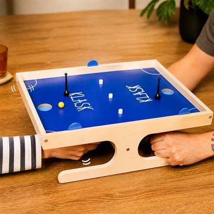 This Magnetic Tabletop Game Turns Air Hockey Into A Tiny Wooden Duel