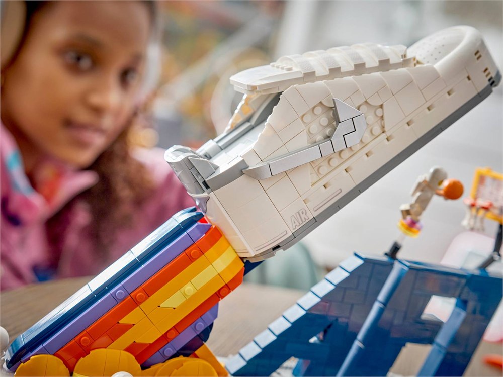 Close view of the LEGO Air Force 1 sneaker details and orange Swoosh
