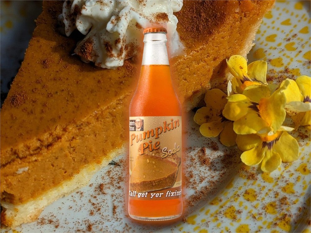 Lesters Fixins Pumpkin Pie Soda bottle with pumpkin pie backdrop
