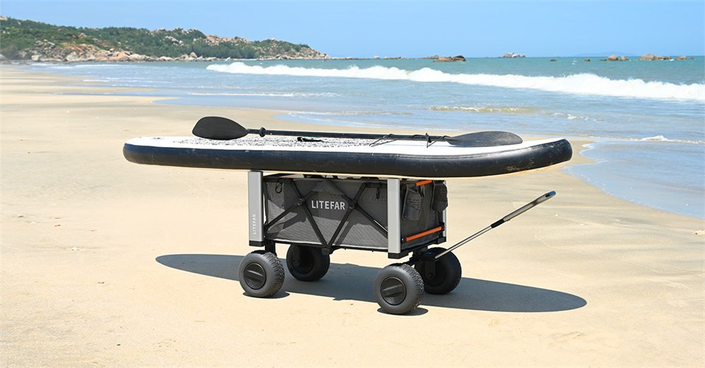 LITEFAR B1 electric beach wagon carrying a paddleboard on sand