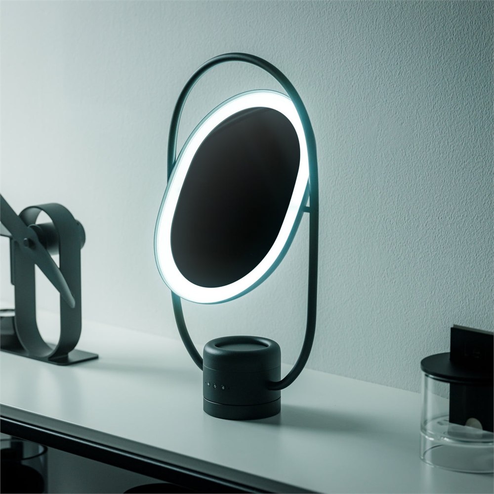 SOL Style luminous mirror diffuser lit on a tabletop