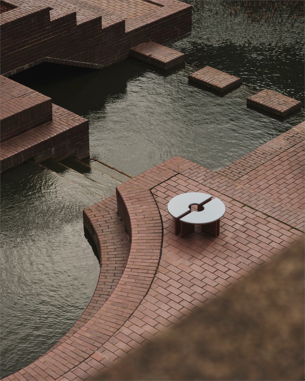 MADE x Barbican Plinth table photographed near the Barbican lake seating curves