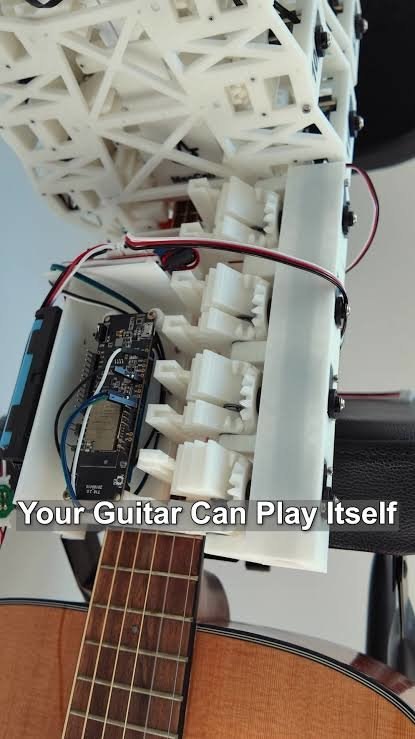 Close-up of the MegCell Pulse fretting actuator on the guitar neck