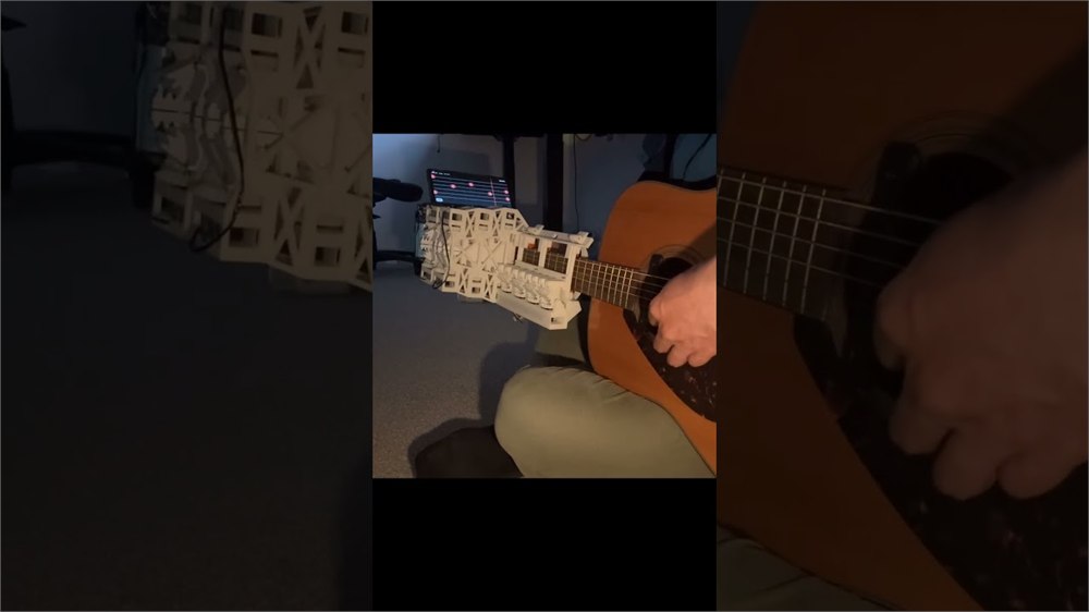 MegCell Pulse demo frame showing the mechanism interacting with guitar strings