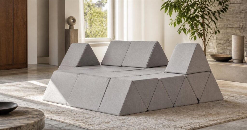 Moooi Peaks grey modular sofa with triangular folding backrests in a modern room