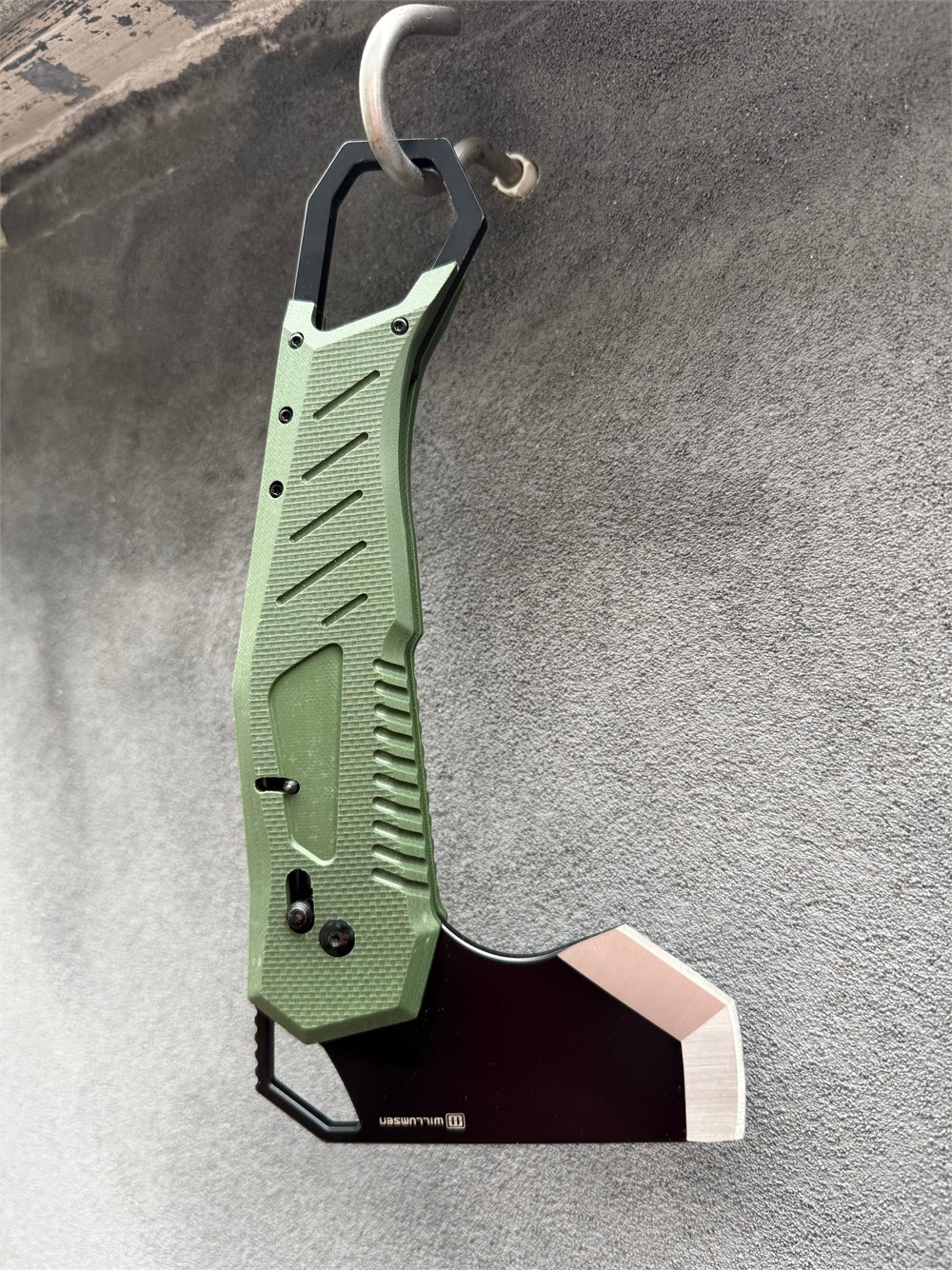 The Willumsen Norse Foldable camp axe shown open in green