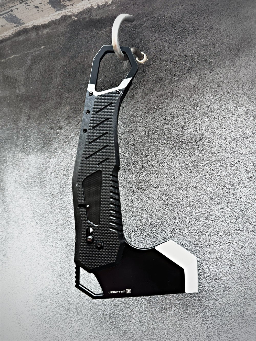 The black Willumsen Norse Foldable camp axe shown open