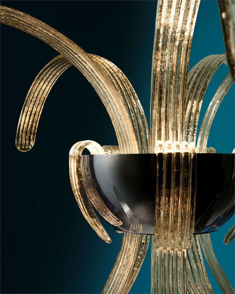 Close detail of clear ribbed Murano glass and polished metal on a Garden fixture