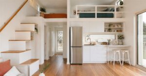 Unplgd Kookaburra 2.0 family tiny home with loft kitchen and storage stairs
