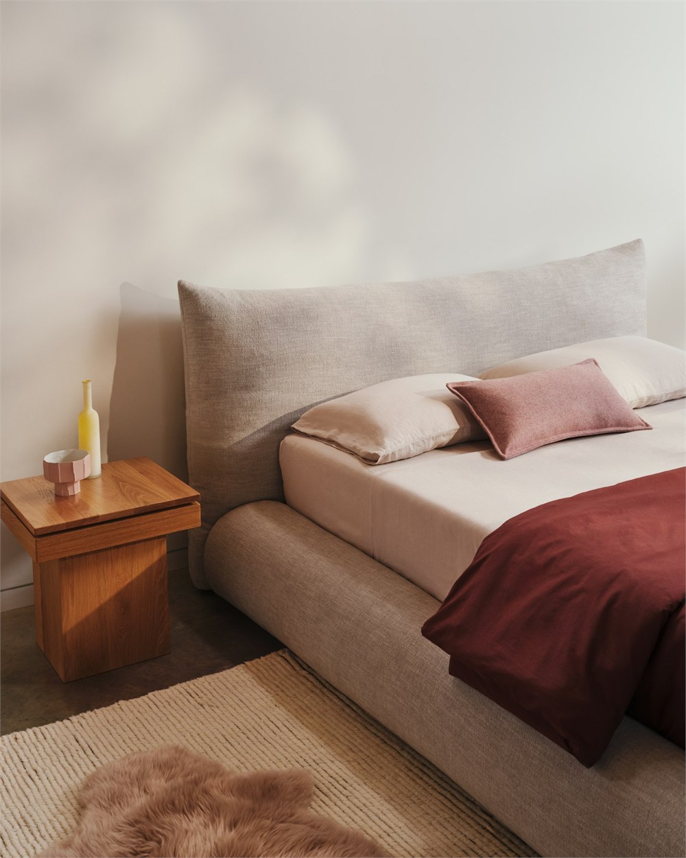 Knoll Perron Pillo Bed in a warm bedroom setting