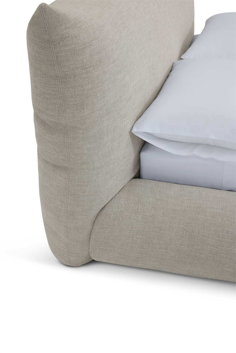 Close detail of the Knoll Perron Pillo Bed rounded upholstered frame