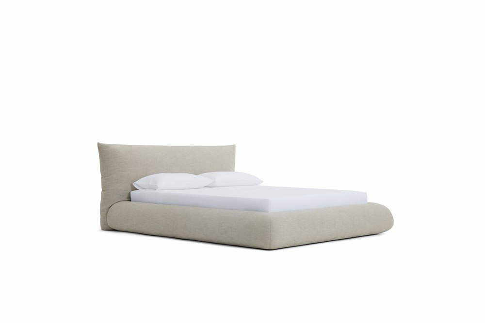 Front view of the Knoll Perron Pillo Bed showing its rounded upholstered frame