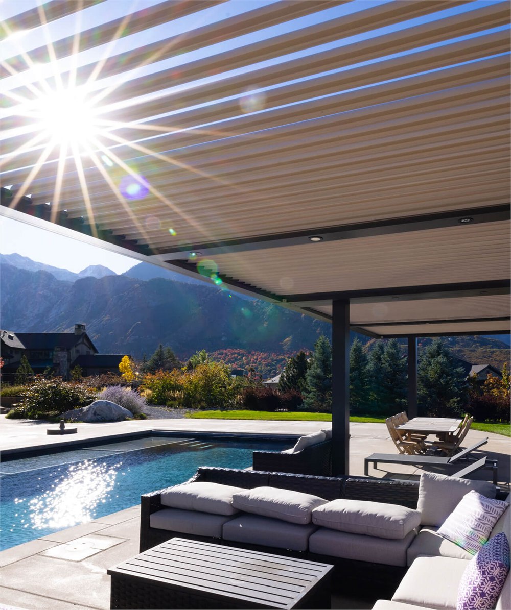 Poolside lounge shaded by a StruXure louvered pergola roof