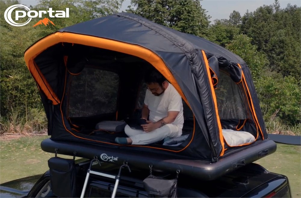 Portal Nomis One tent mounted on a vehicle with ladder