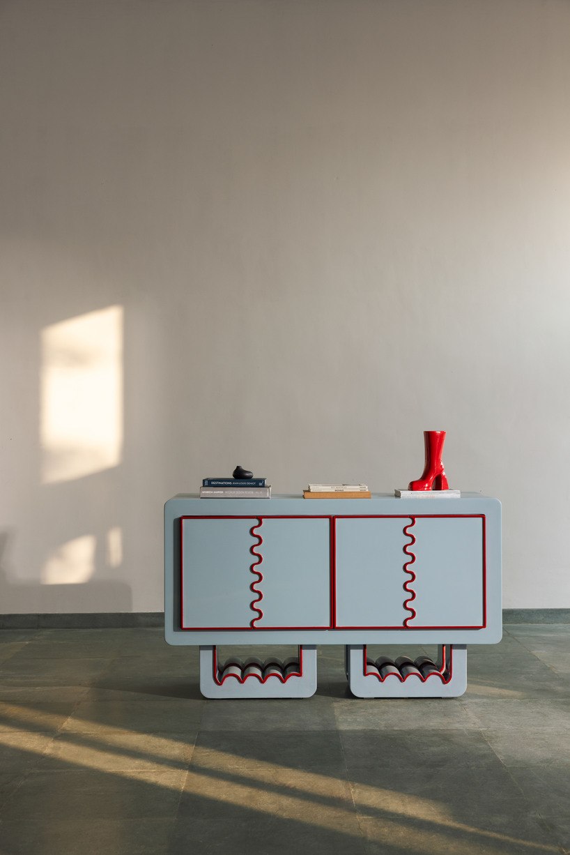 Ramino Series console with red trim and scalloped cabinet openings