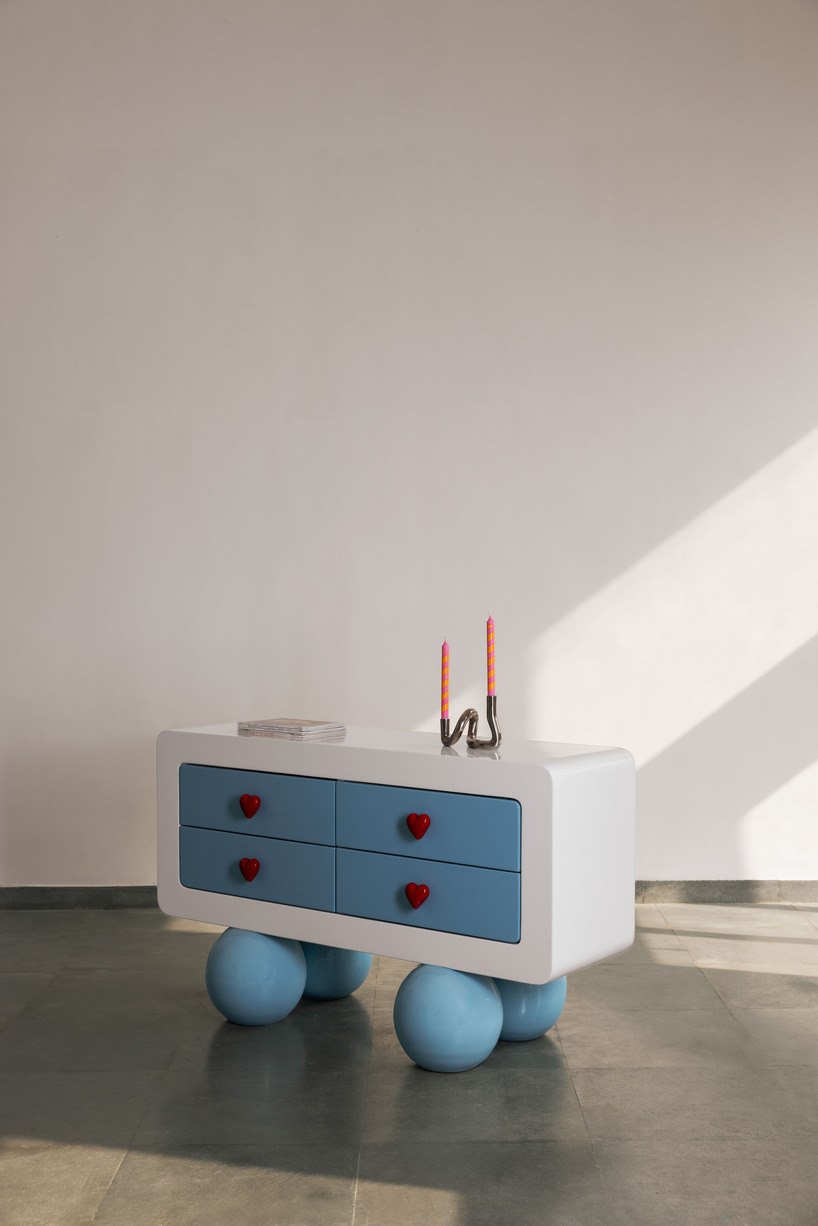 Blue Ramino storage console with rounded feet and colorful drawers