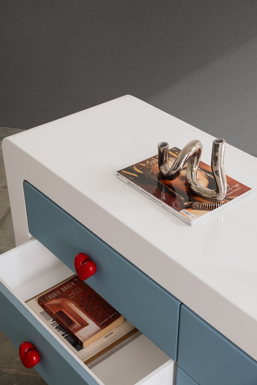 Close detail of Ramino console showing storage and colorful forms