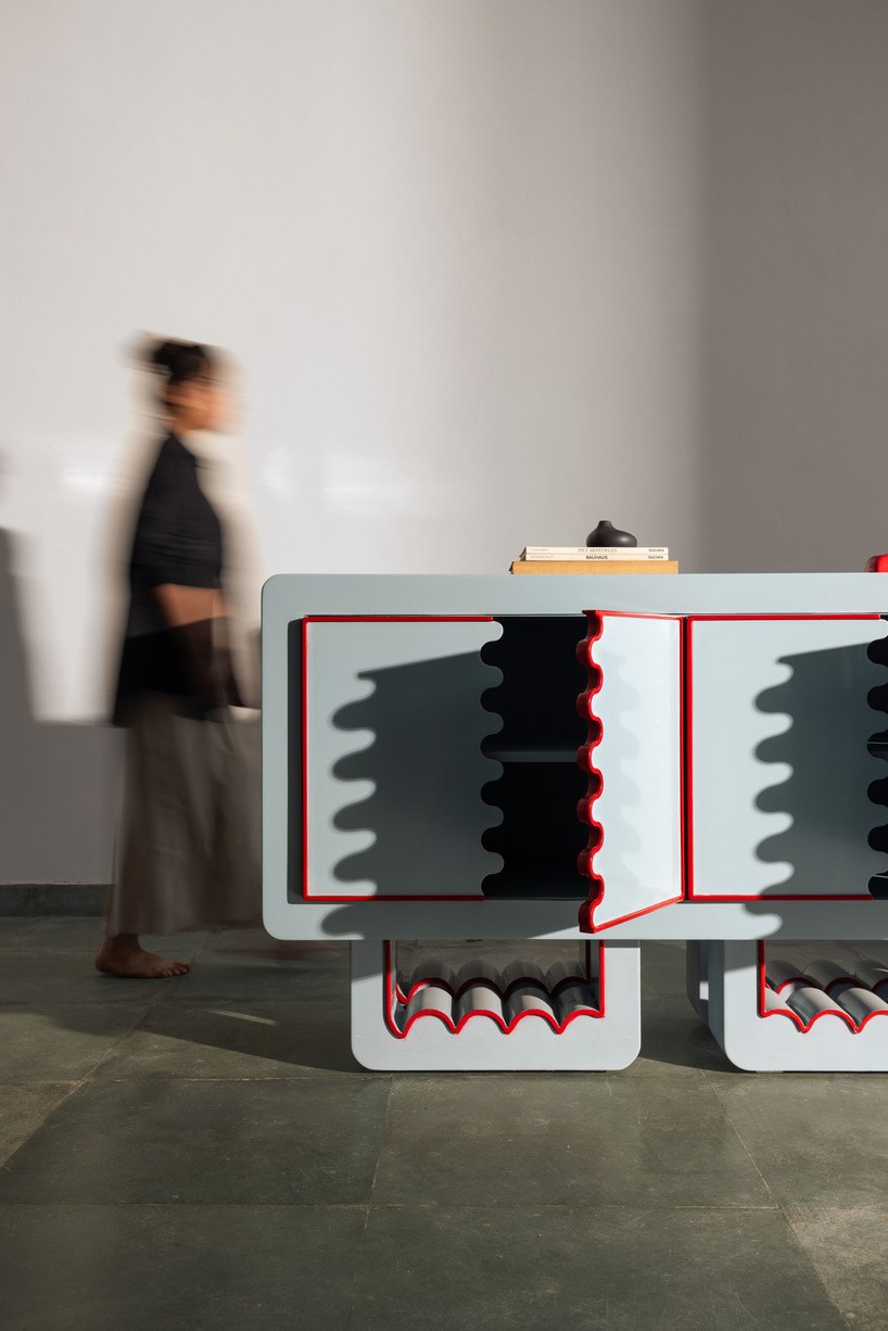 Ramino console shown with a person for scale in a gallery-like room