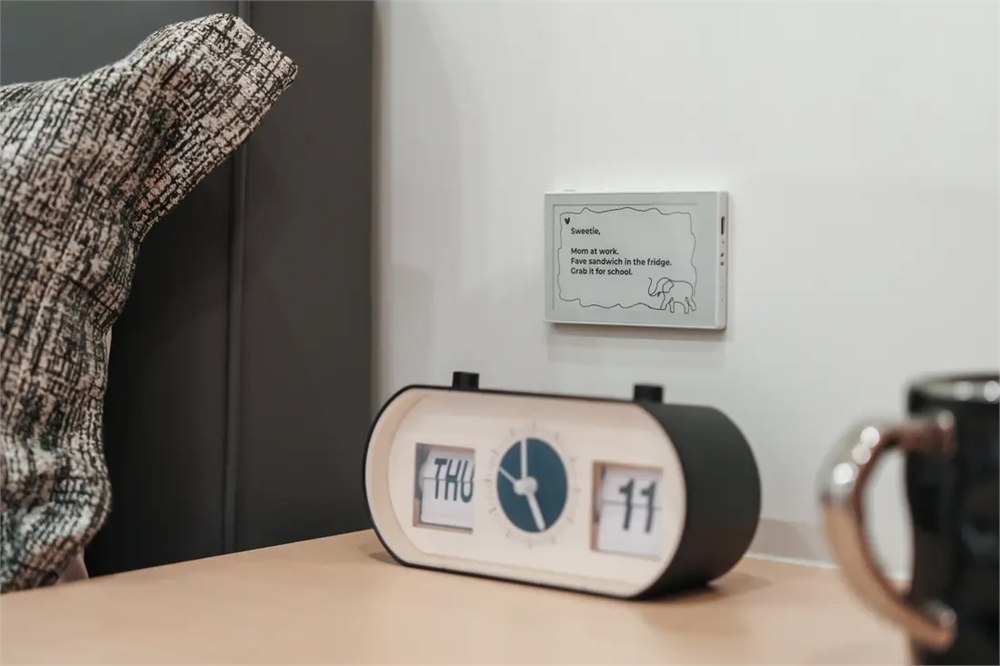 reTerminal Sticky displaying a family message on a wall