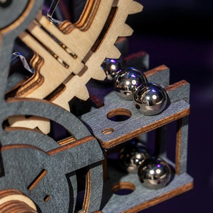 Close-up of steel marbles and wooden gear teeth on a ROKR marble run
