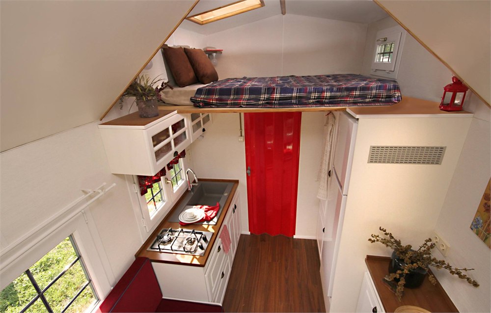 Loft and upper storage area inside the Saly Sunrise tiny house