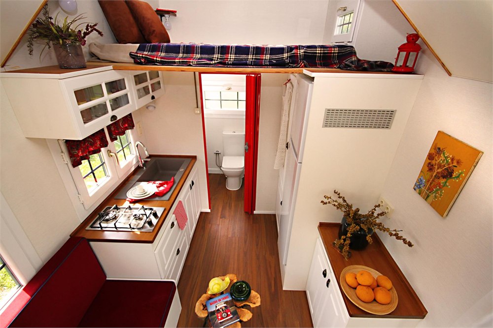 Bathroom inside the Saly Sunrise tiny house with toilet sink and shower