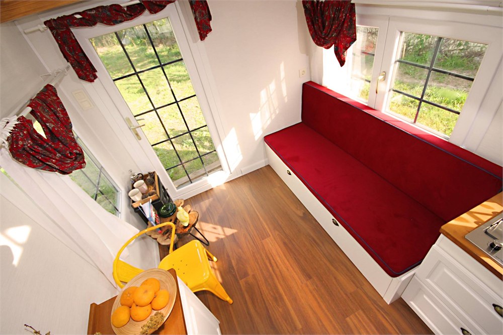 Sleeping loft inside the Saly Sunrise tiny house with skylight