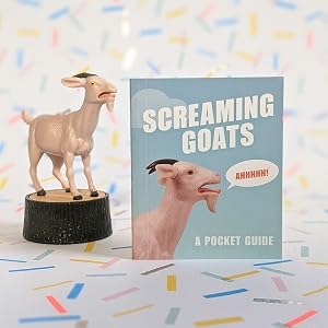 The screaming goat figurine displayed beside the included pocket guide