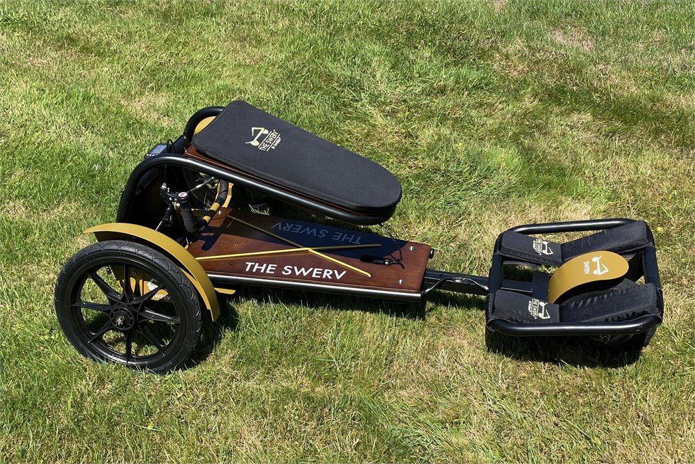 Sweren Swerv trike with product storage unit and low three-wheel profile on grass