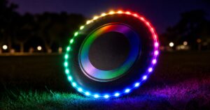 TOSY RGB LED flying disc glowing on grass at night