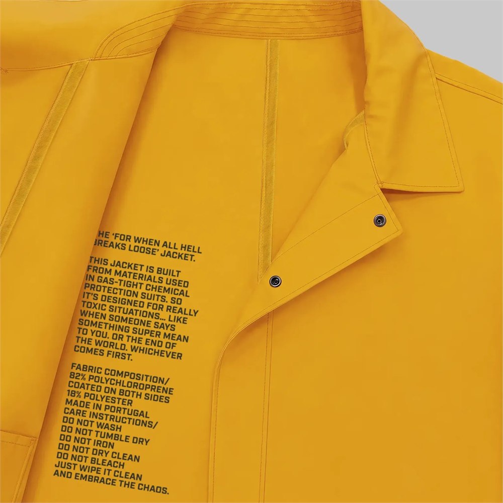 Close-up label detail on the Chemical Proof Yellow rubber-coated jacket
