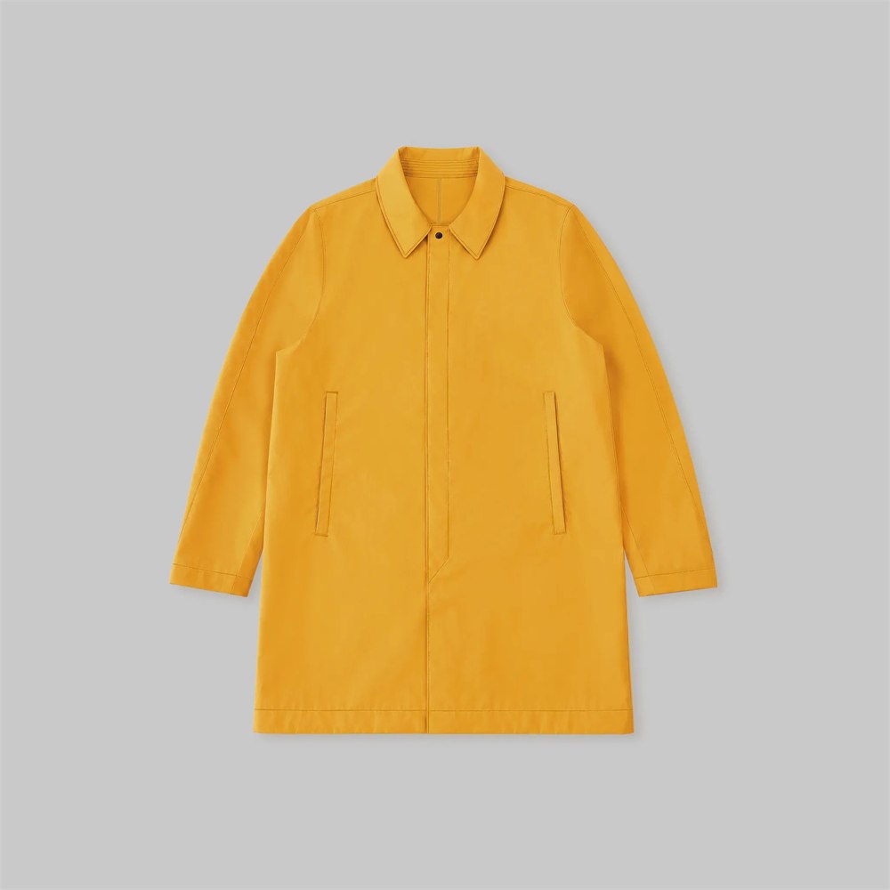 Full front view of the bright yellow rubber-coated trench coat