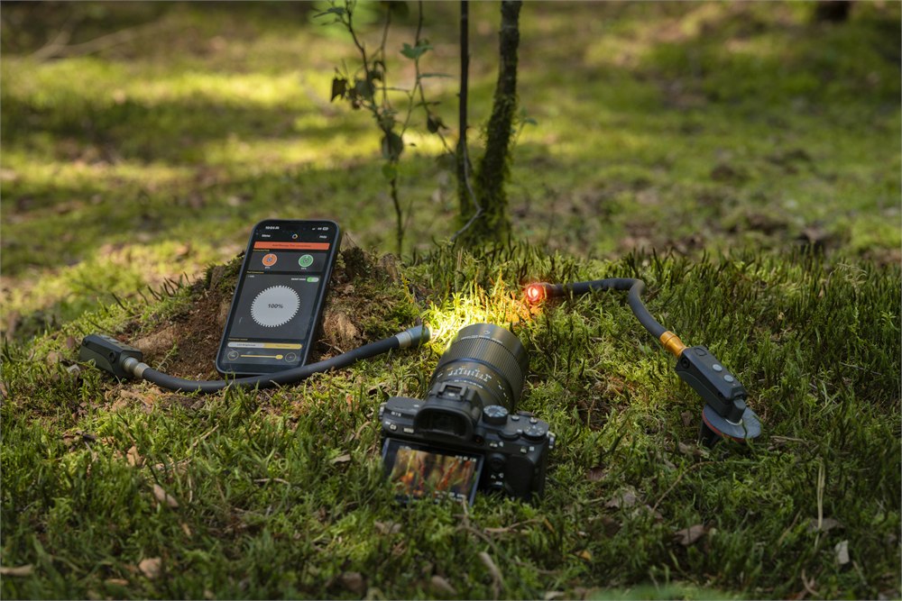 Adaptalux Pod Mini 2.0 macro lighting kit with app control in a mossy outdoor setup