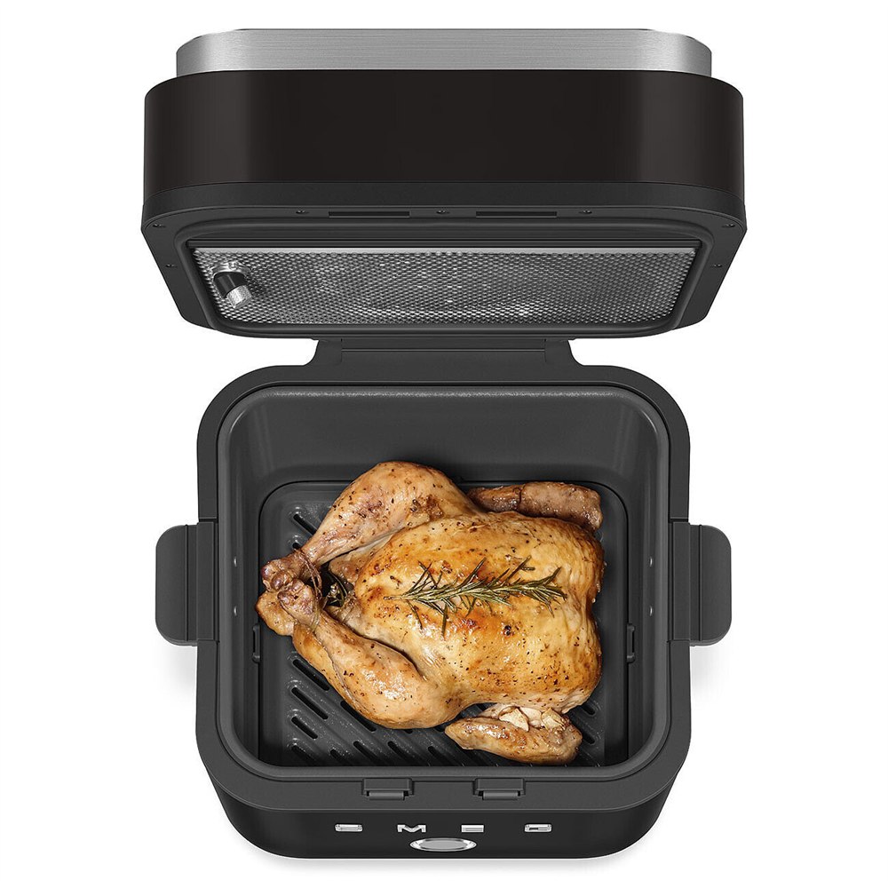 Overhead view of a roast chicken in the open air fryer basket