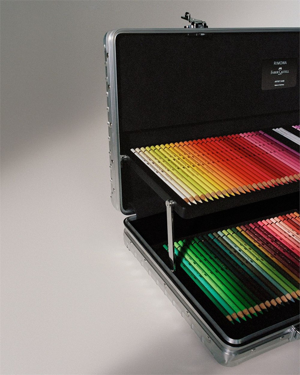 Close view of the raised pencil tray and black case interior