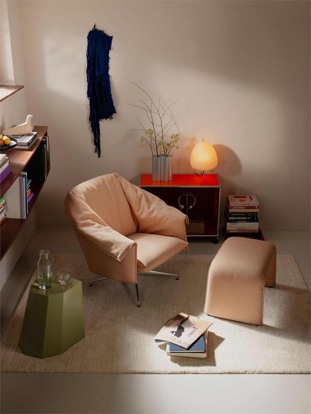 Bascule lounge chair and separate coordinating bench in a living room