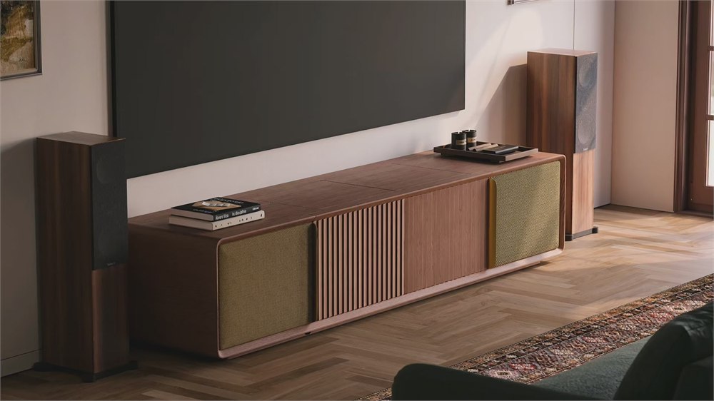 CINÉST Core media console set beneath a projector screen in a modern living room