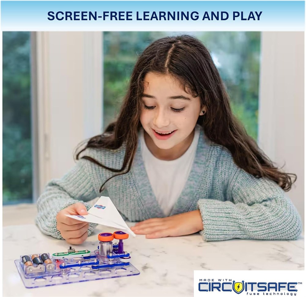 Child using a paper airplane with the Flight Deck circuit launcher