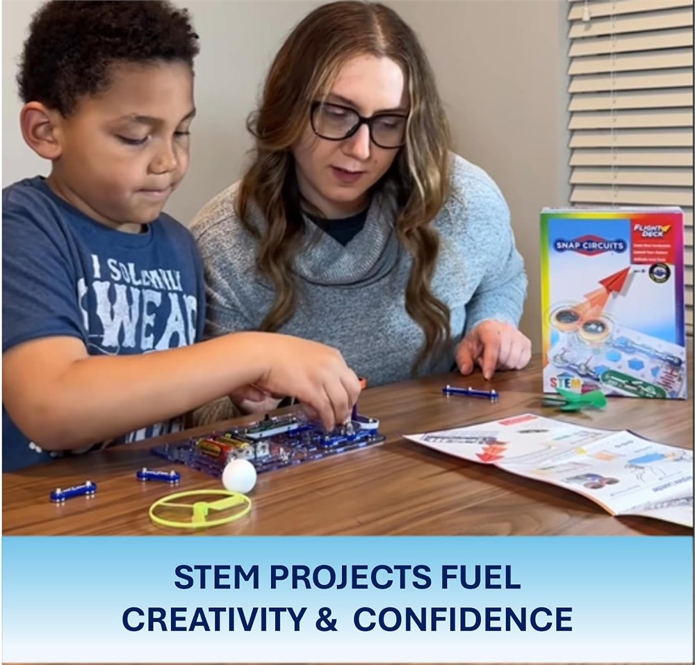 Adult and child building the Snap Circuits Flight Deck kit