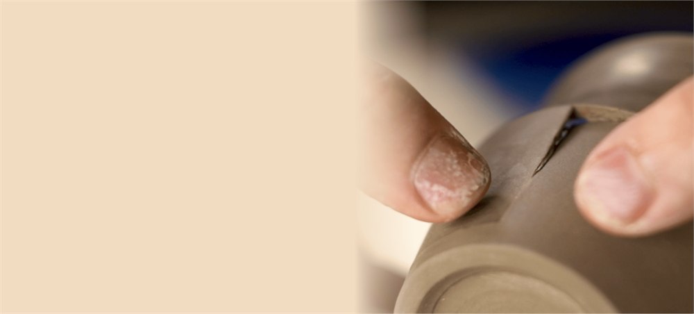 Artisan shaping a porcelain cup