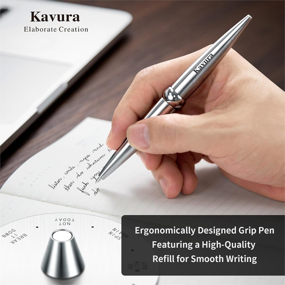 Metal decision pen used for writing in a notebook