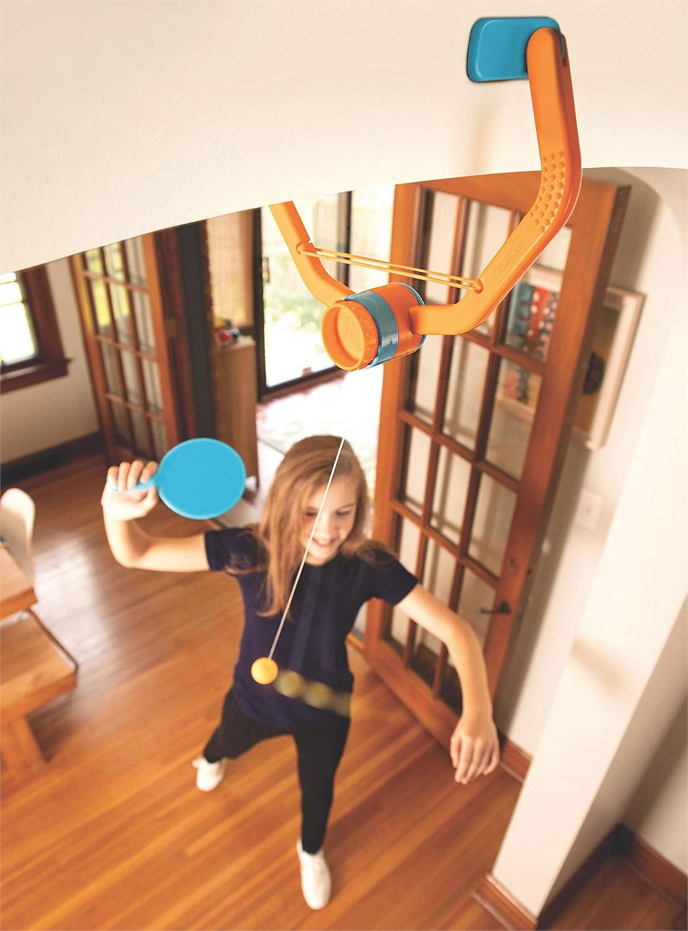 Fat Brain Toys Door Pong clamped over a doorway during indoor play