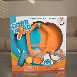 Door Pong active play photo showing doorway ping pong setup